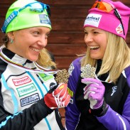 Jessie Diggins (right) and Caitlin Gregg display their medals from the Nordic World Ski Championships. Image courtesy of U.S. Ski Team/Tom Kelly.