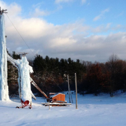 Peabody Ice Climbing Club's towers sit in the middle of an apple orchard.