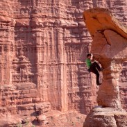 Alex Honnold in the midst of the red rock.