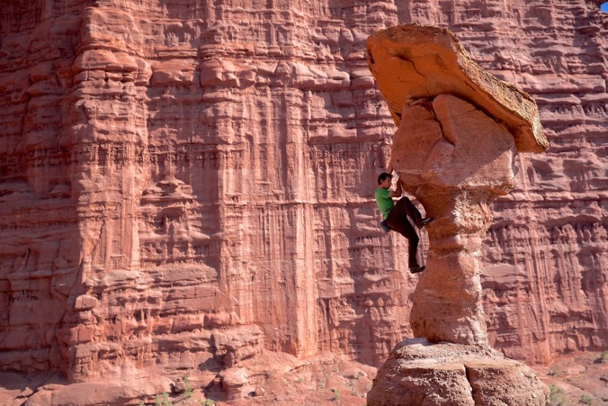 Alex Honnold in the midst of the red rock.