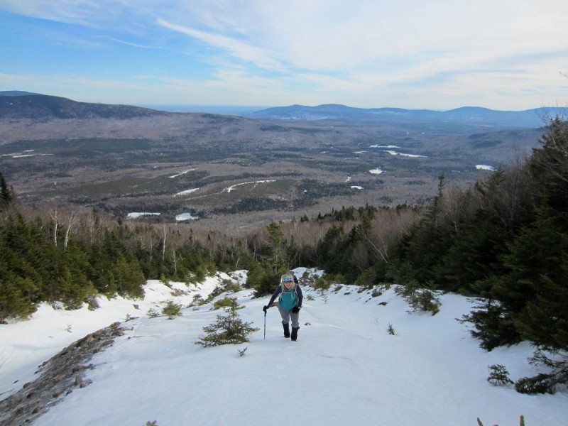 A hiker ascend Maine's Baker Mountain. Image courtesy of Appalachian Mountain Club.