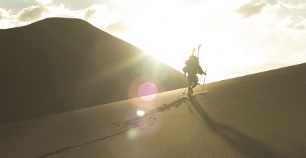 Wade-Holland-hiking-to-the-top-of-Star-Dune