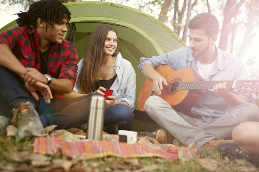 group-guitar-tent-camping-sponsored