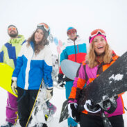 two-couples-having-fun-snowboarding